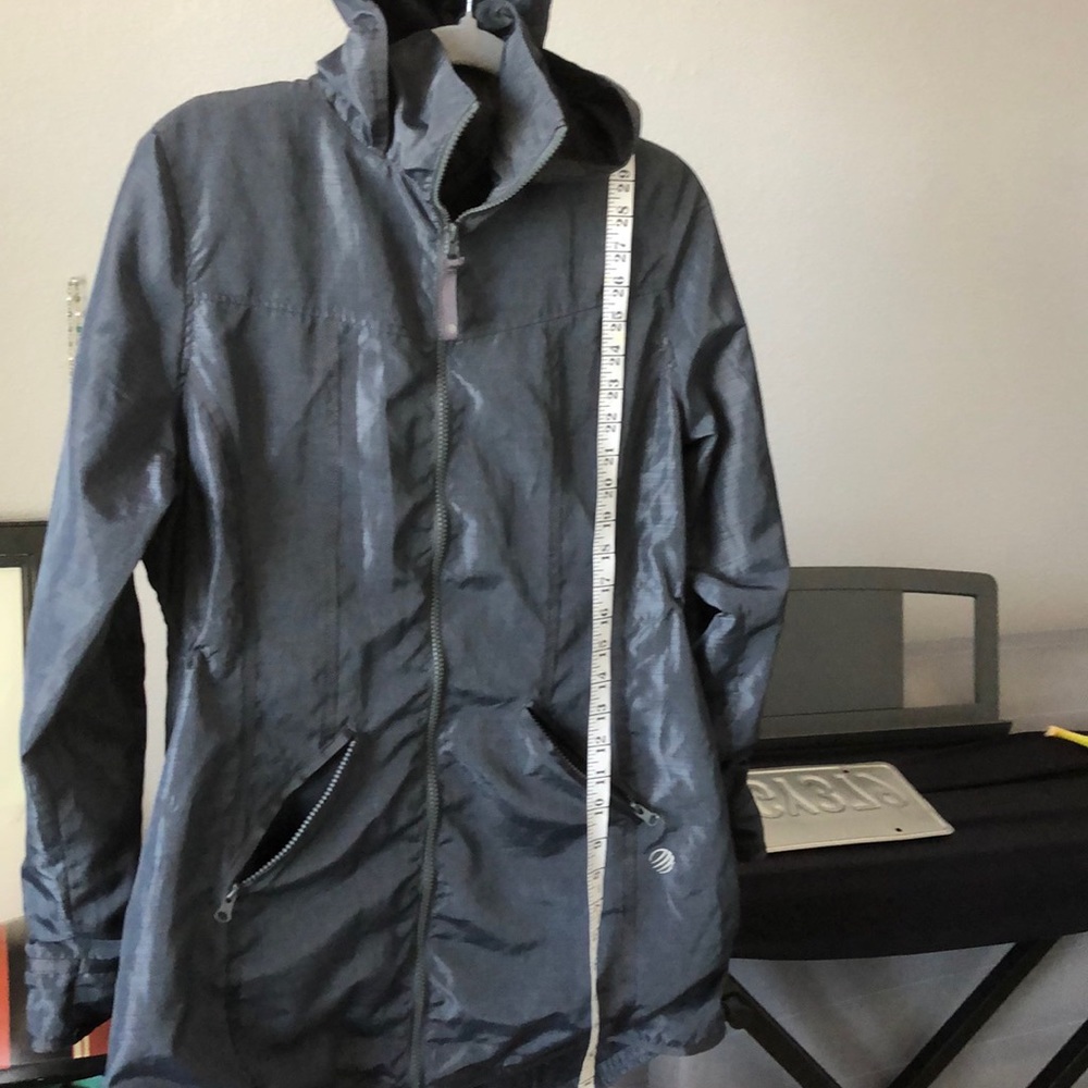 Women’s hooded windbreaker by MPG 100% polyester.